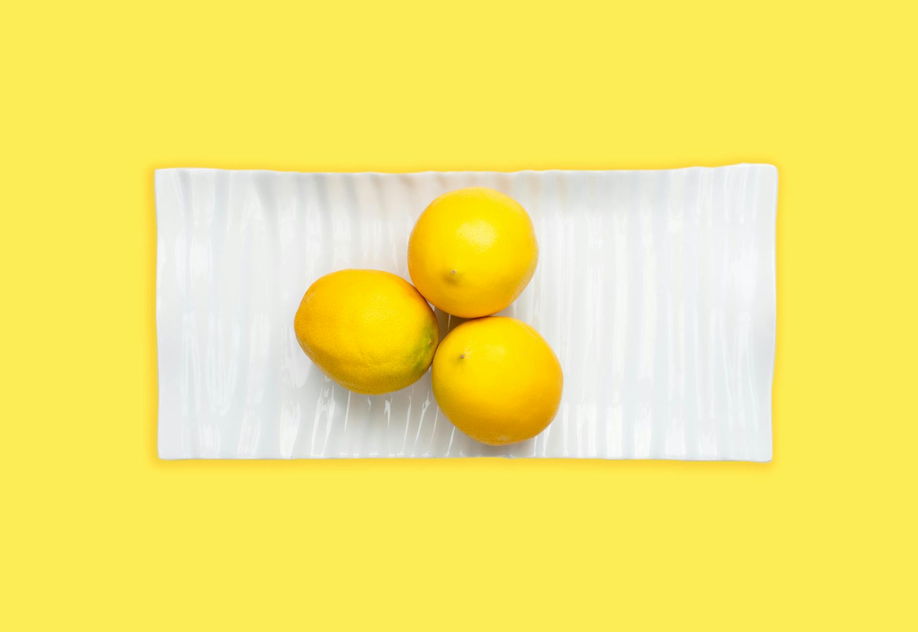 Fresh lemons symbolizing the bright, pleasurable sensation of using lemon clitoral vibrators
