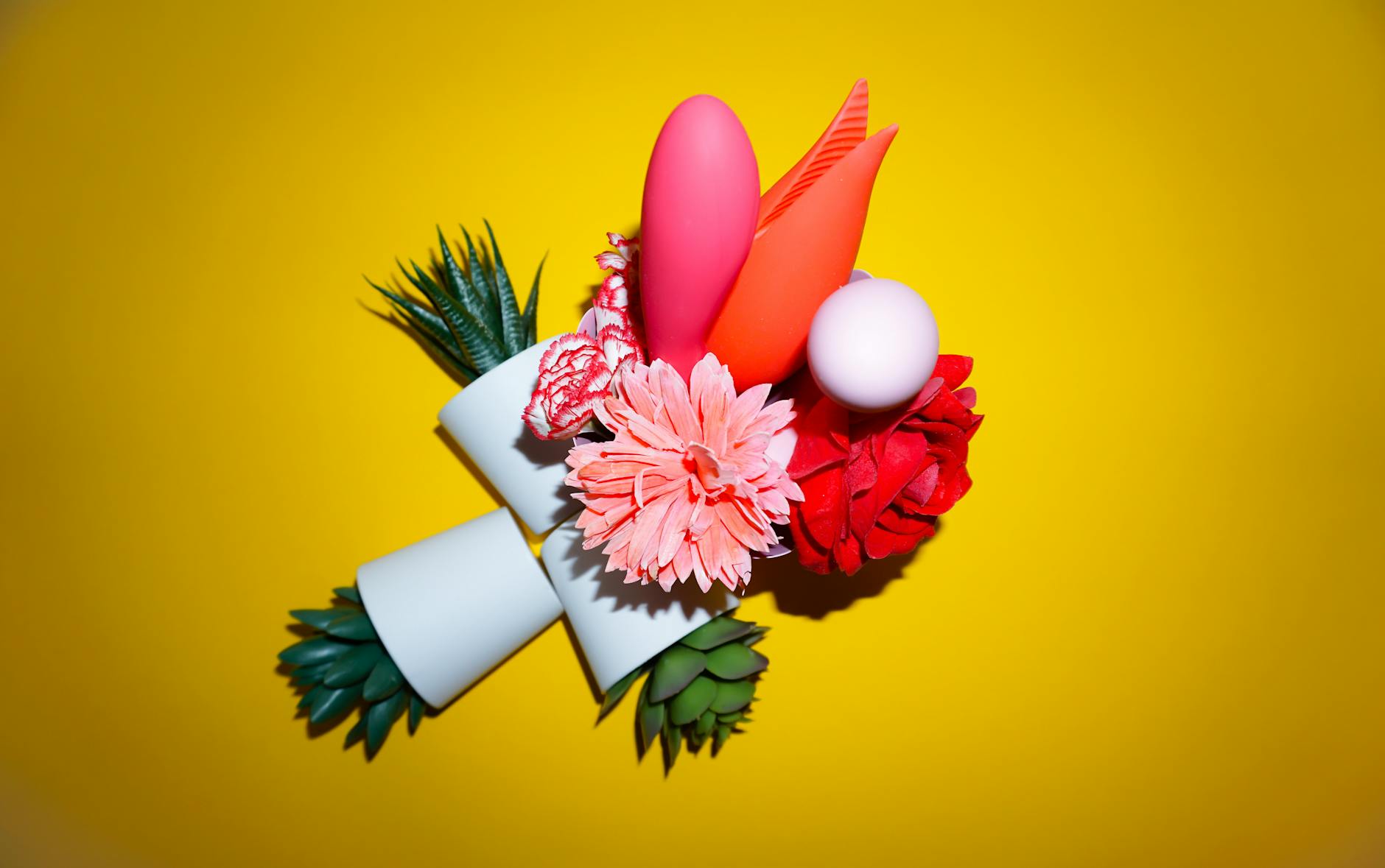 A woman holds colorful vibrators against a purple background, exploring clitoral stimulation options